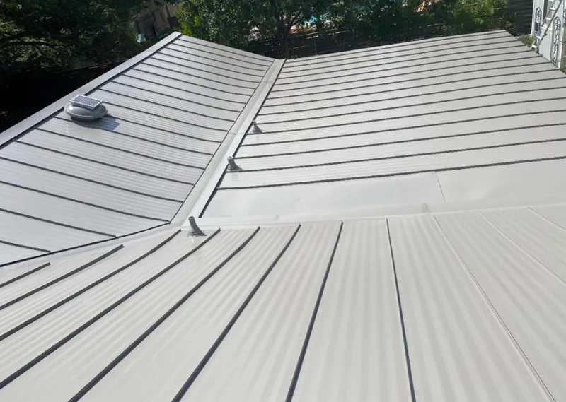 Solar attic fan installed on a metal roof for Roof Ventilation in Fremont